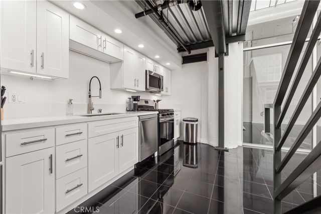 a bathroom with a shower and a sink