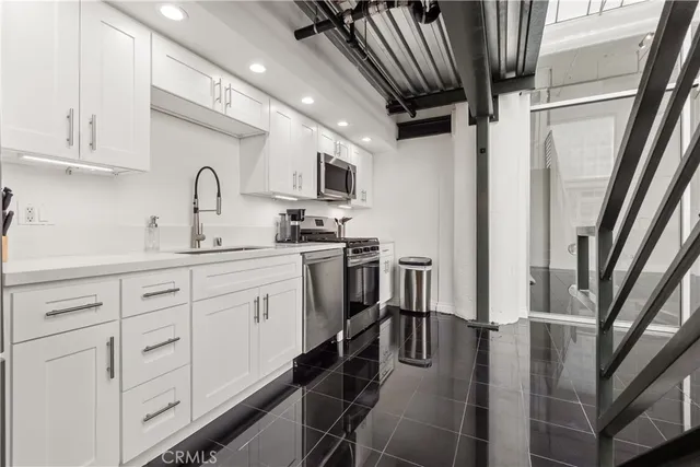 a bathroom with a shower and a sink