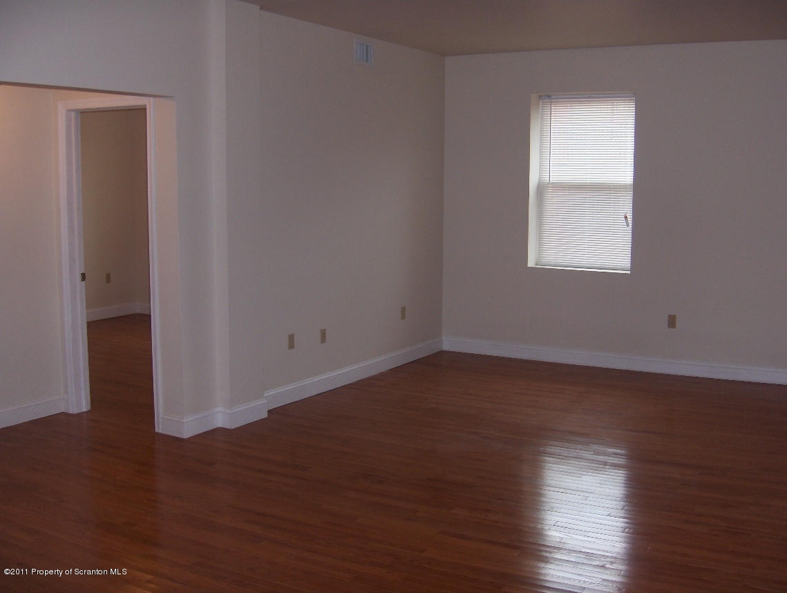 329 Penn Avenue Scranton, PA 18503 - Photo 2 of 5 a view of a room that has wooden floor in it