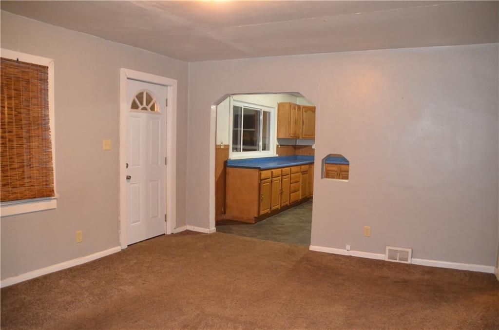 1312 Dime Road Vandergrift, PA 15690 - Photo 8 of 20 an empty room with windows