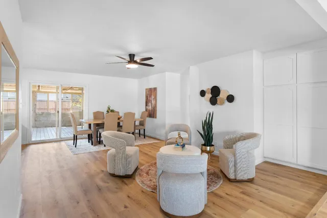 a living room with furniture and a potted plant