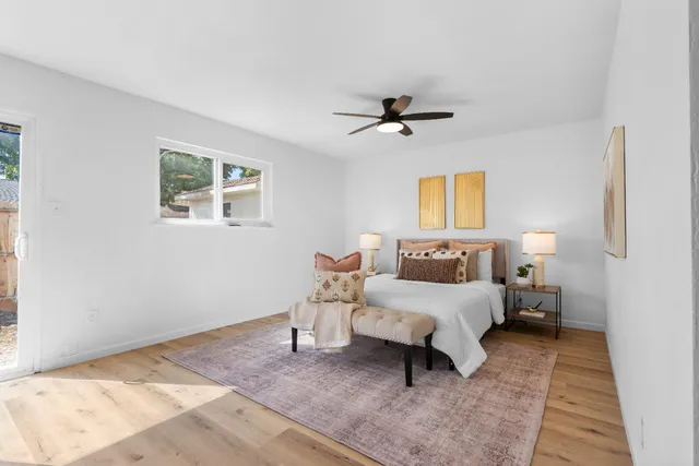 a bedroom with bed and a window