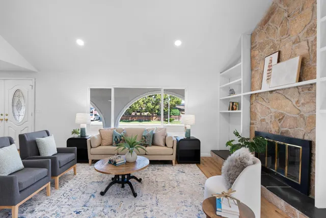 a living room with furniture and a lamp