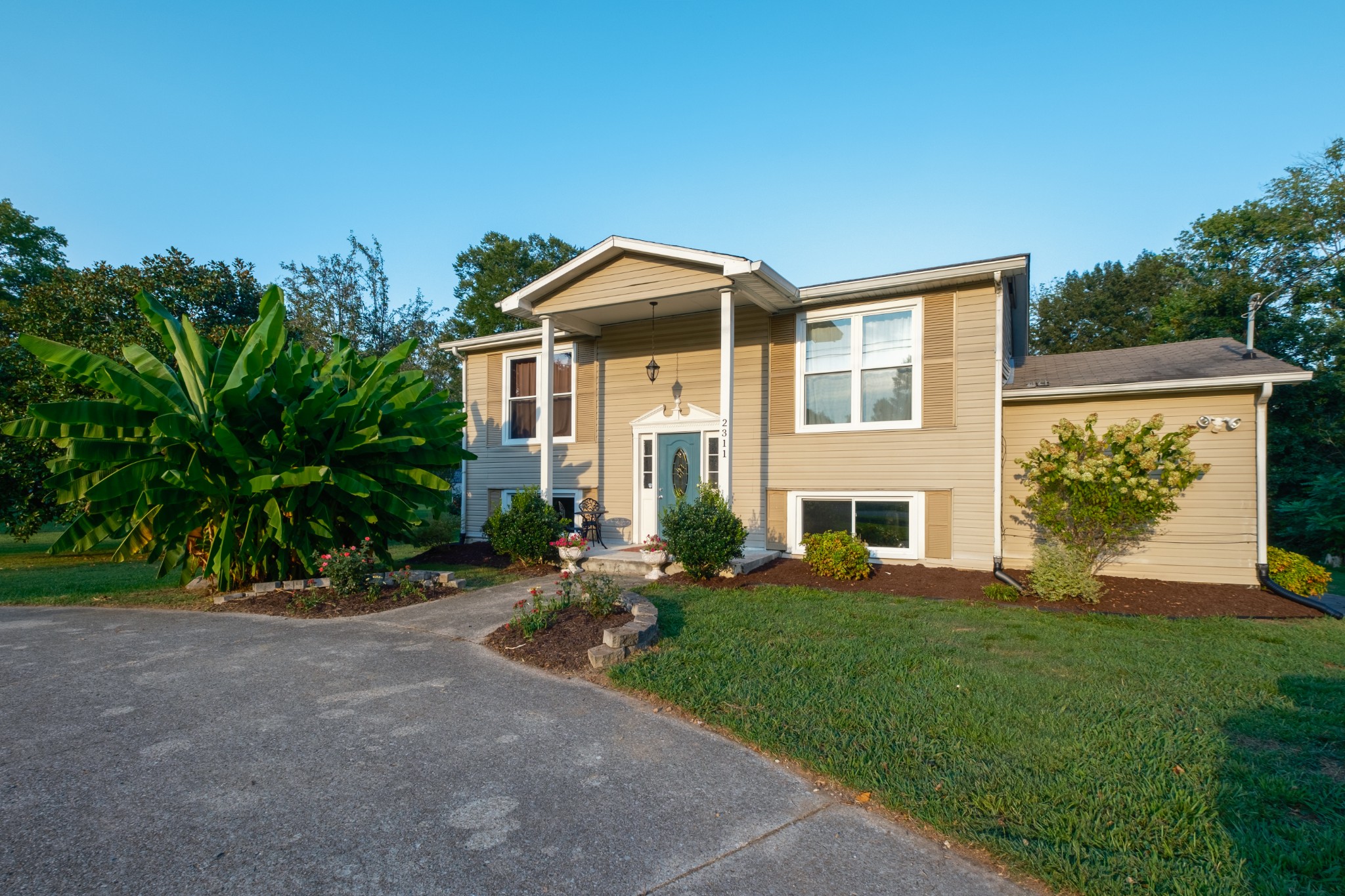 a front view of a house with a yard