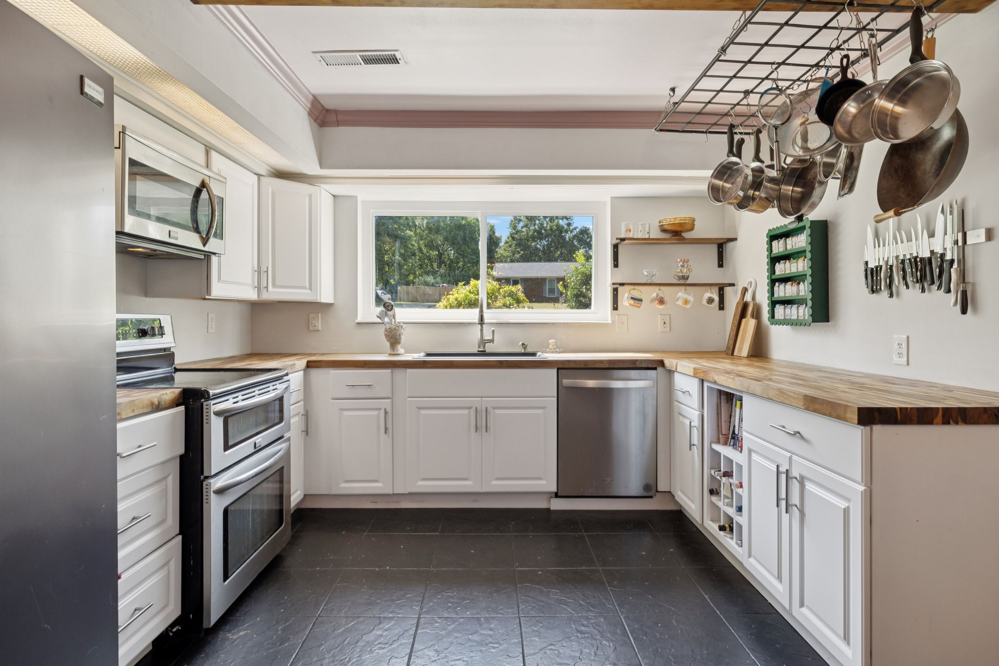 2311 Raspberry Lane Lebanon, TN 37087 - Photo 13 of 49 a kitchen with a sink stove and cabinets