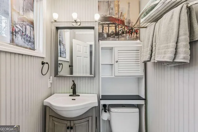 a bathroom with a sink a mirror and shower