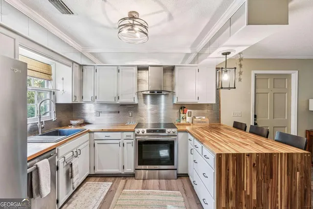 a kitchen with a stove and a sink