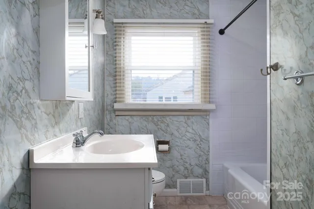 a bathroom with a sink and a bathtub