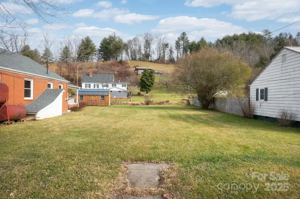 a view of a yard with an outdoor space