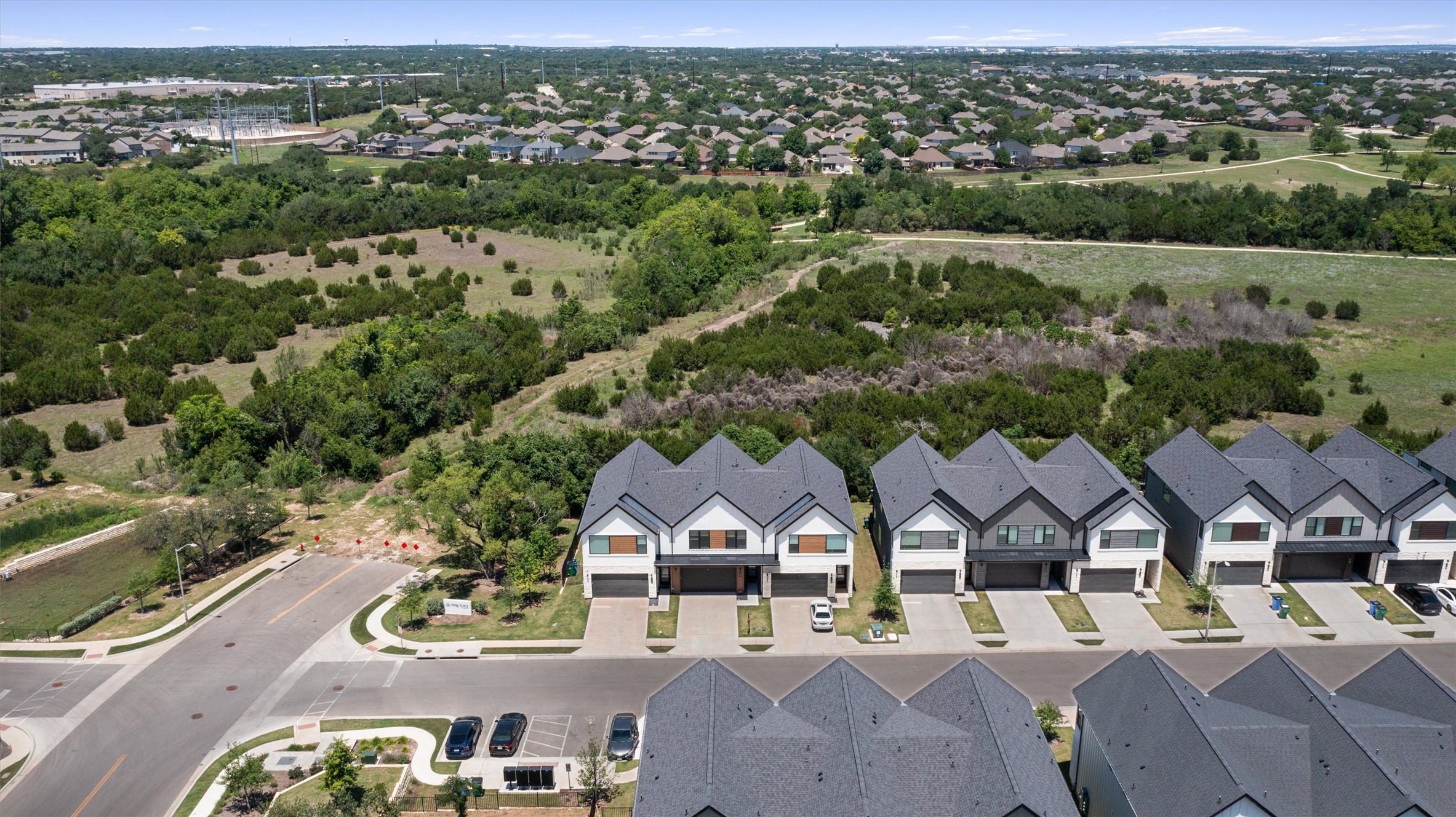 590 Old Mill Road, Unit 153 Cedar Park, TX 78613 - Photo 35 of 40 an aerial view of a house with a garden