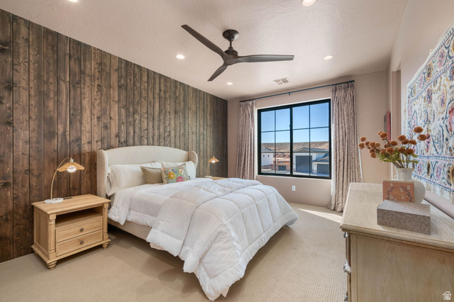 4871 South Homestead Way Washington, UT 84780 - Photo 83 of 151 Bedroom with light carpet, a ceiling fan, recessed lighting, and wood walls