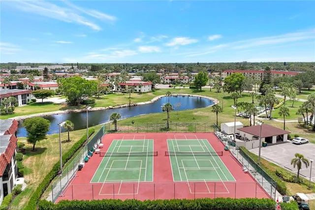 a view of swimming pool with outdoor seating