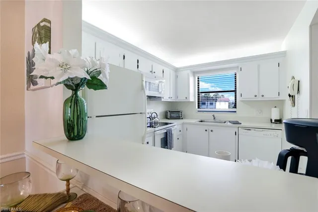 a kitchen with cabinets a sink and a stove