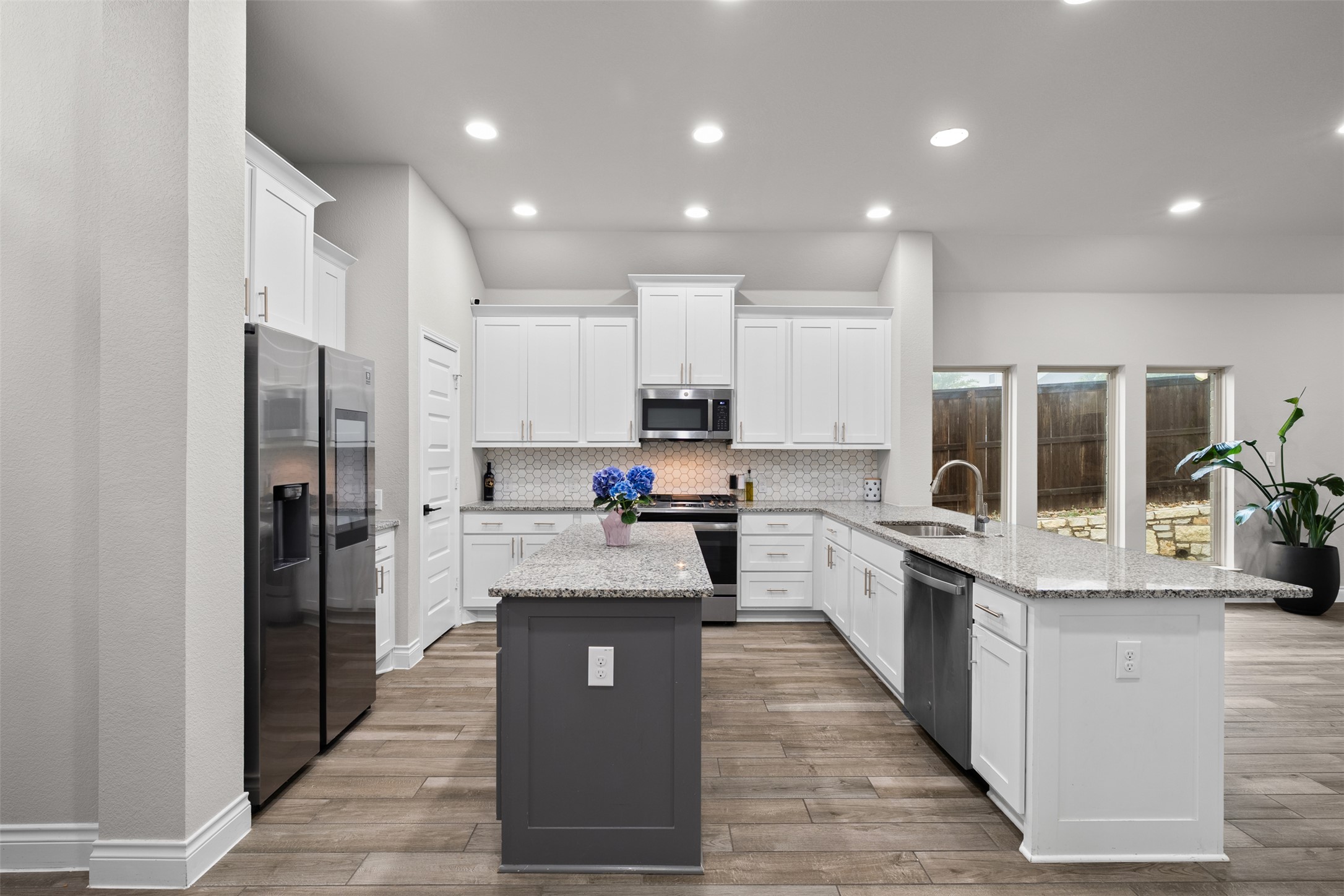 341 Pisa Lane Georgetown, TX 78628 - Photo 10 of 31 a large kitchen with stainless steel appliances lots of counter space and a sink