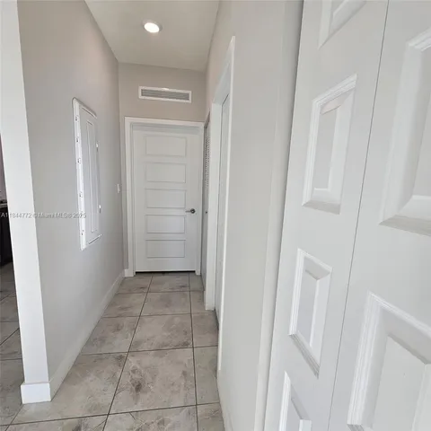 a bathroom with a sink a toilet and shower curtain