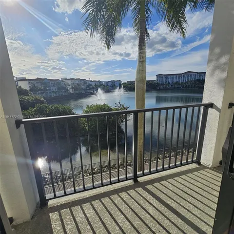 a view of a balcony with wooden floor