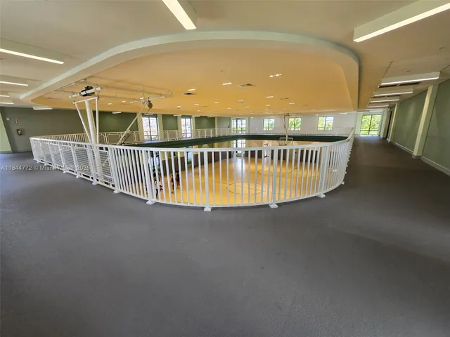 a kitchen with stainless steel appliances kitchen island a stove and a sink