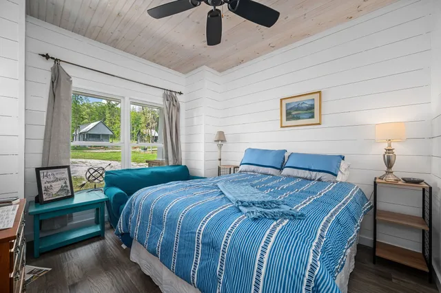 a bedroom with bed and a window