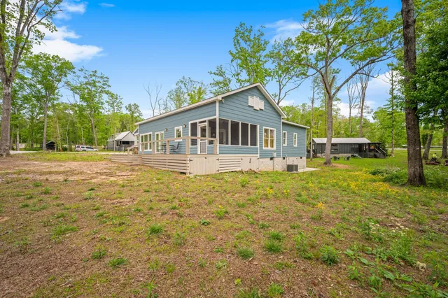 a house with trees in the background
