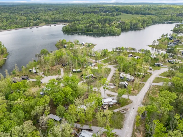 an aerial view of a houses with yard