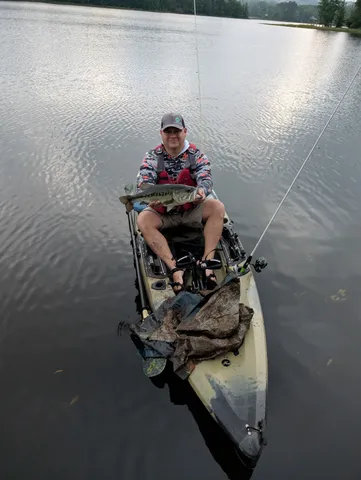 a view of a room with water heater and racks on the wall
