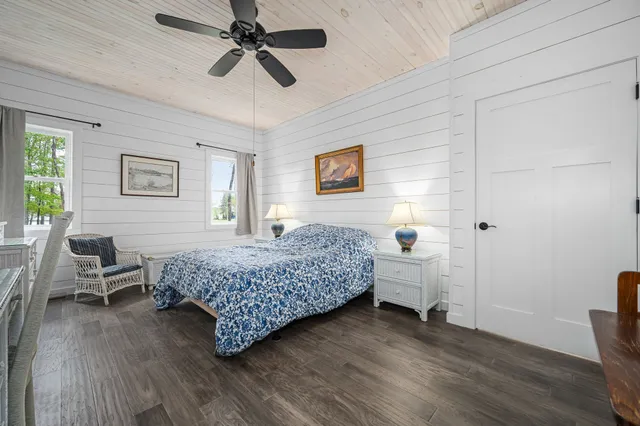 a room with a bed and furniture