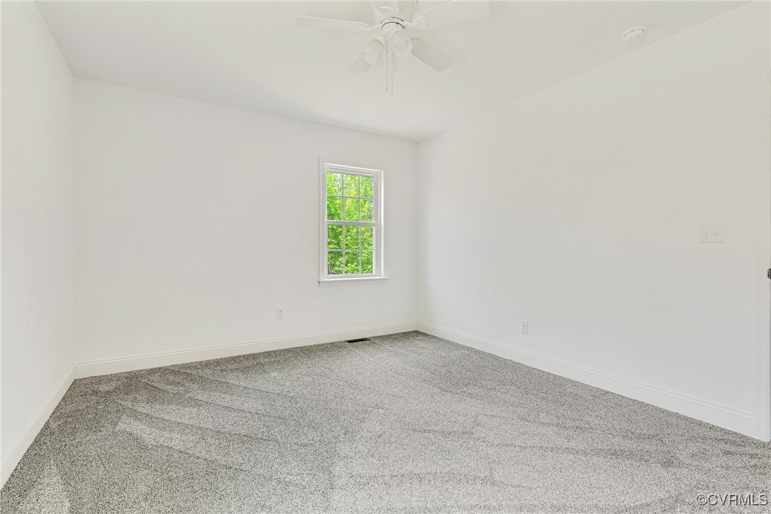 1684 Halls Store Road Mineral, VA 23117 - Photo 17 of 40 Carpeted spare room featuring visible vents, baseb