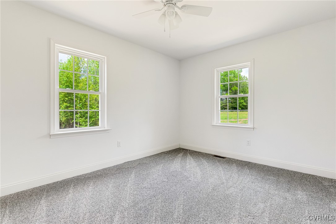 1684 Halls Store Road Mineral, VA 23117 - Photo 18 of 40 Carpeted spare room featuring visible vents, baseb
