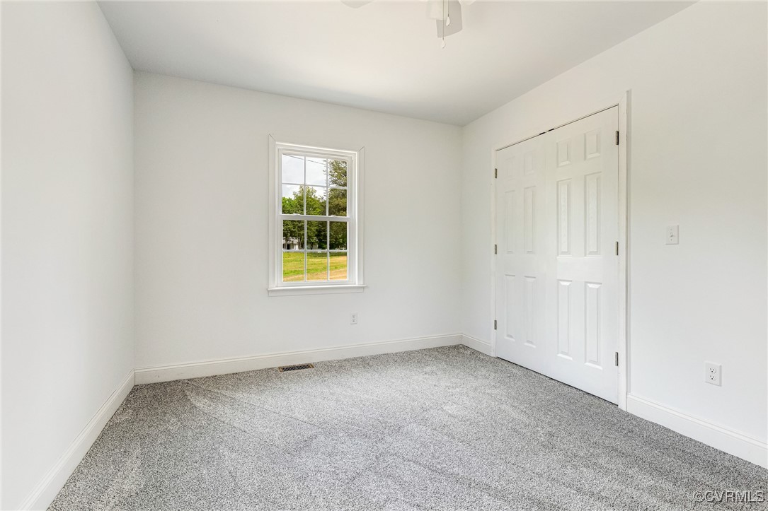1684 Halls Store Road Mineral, VA 23117 - Photo 20 of 40 Unfurnished bedroom with a ceiling fan, a closet,