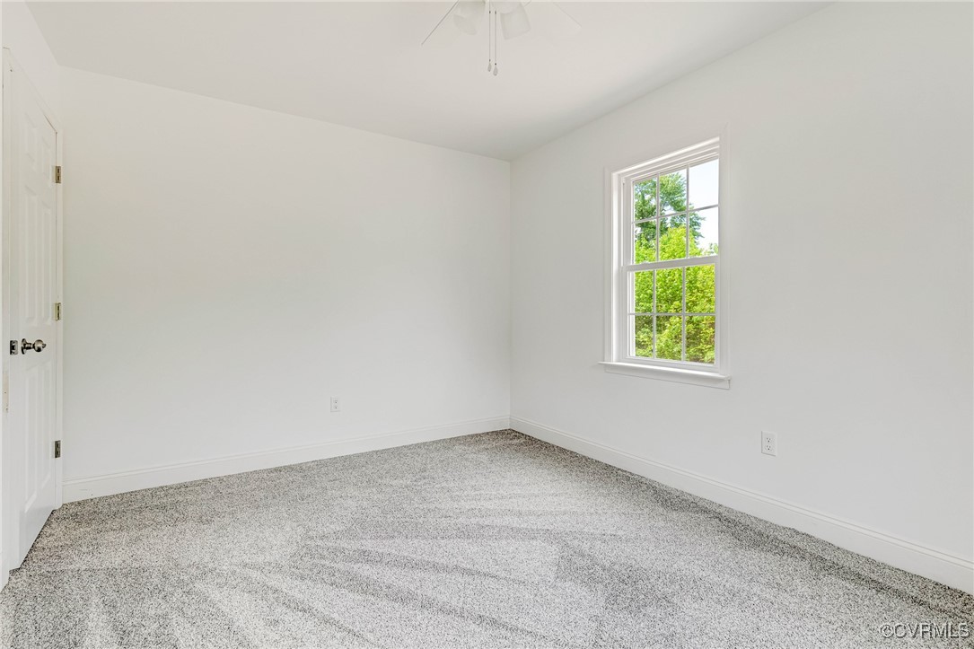 1684 Halls Store Road Mineral, VA 23117 - Photo 21 of 40 Spare room with carpet flooring, baseboards, and a
