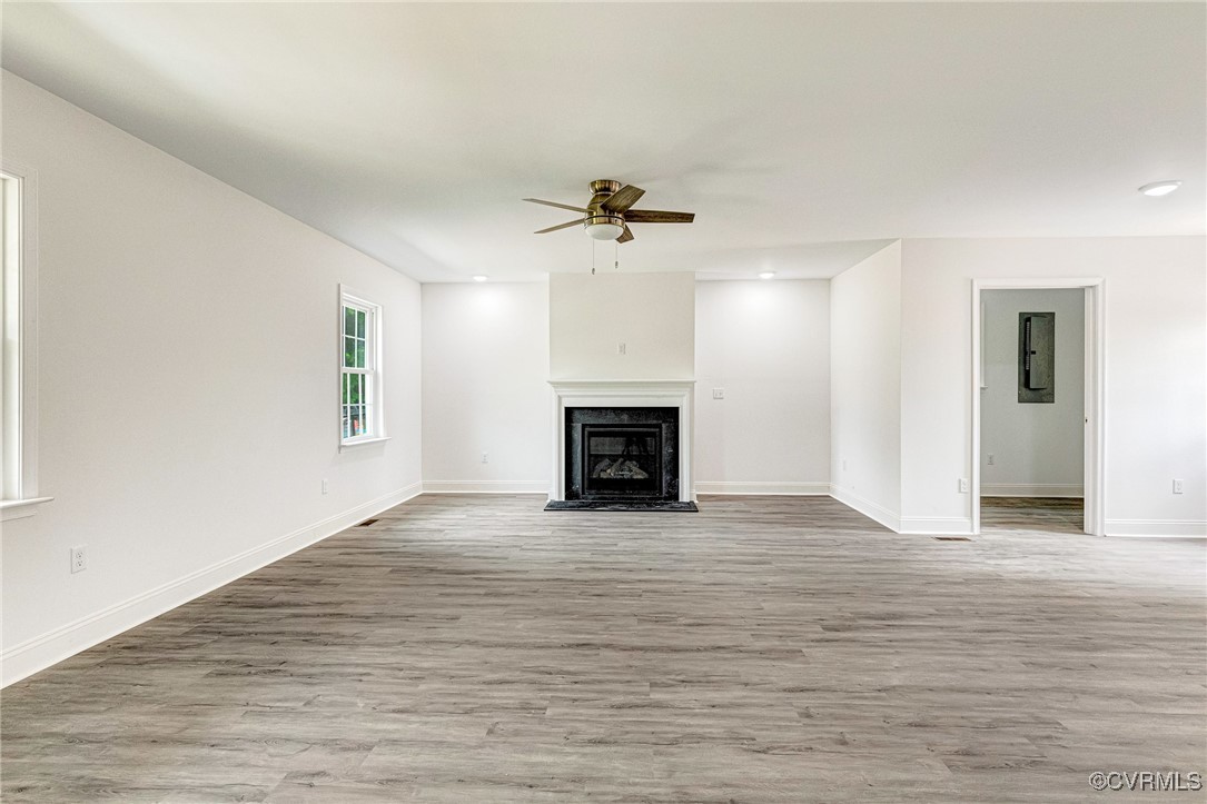 1684 Halls Store Road Mineral, VA 23117 - Photo 3 of 40 Unfurnished living room featuring baseboards, wood