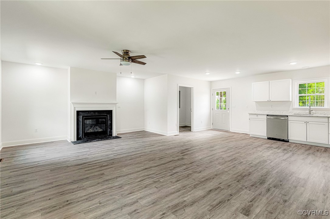1684 Halls Store Road Mineral, VA 23117 - Photo 4 of 40 Unfurnished living room featuring a sink, light wo