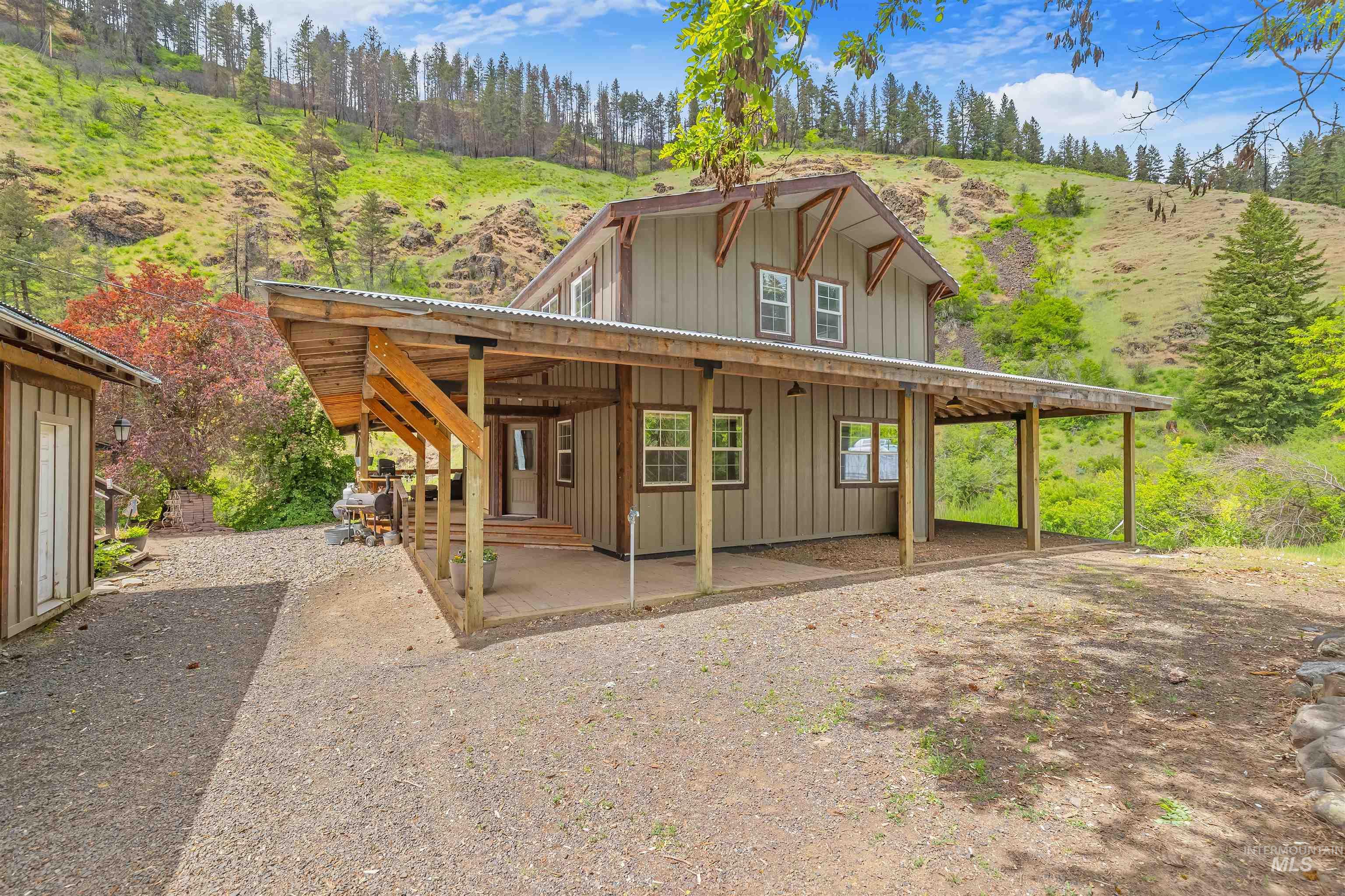 1314 Cedar Ridge Road Kendrick, ID 83537 - Photo 3 of 50 Two-story structure featuring a board-and-batten siding finish and exposed rafter tails