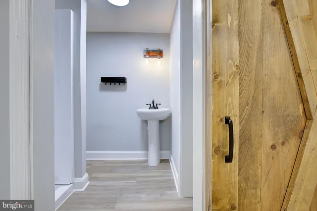 a bathroom with a sink a mirror a shower and vanity