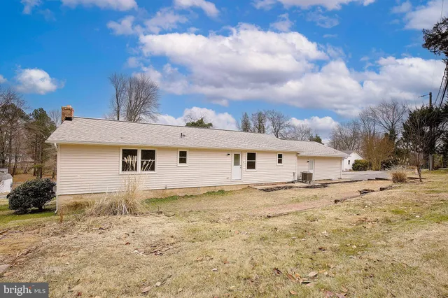 a view of a house with a snow in the yard