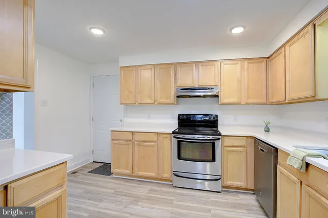 a kitchen with a stove and a sink