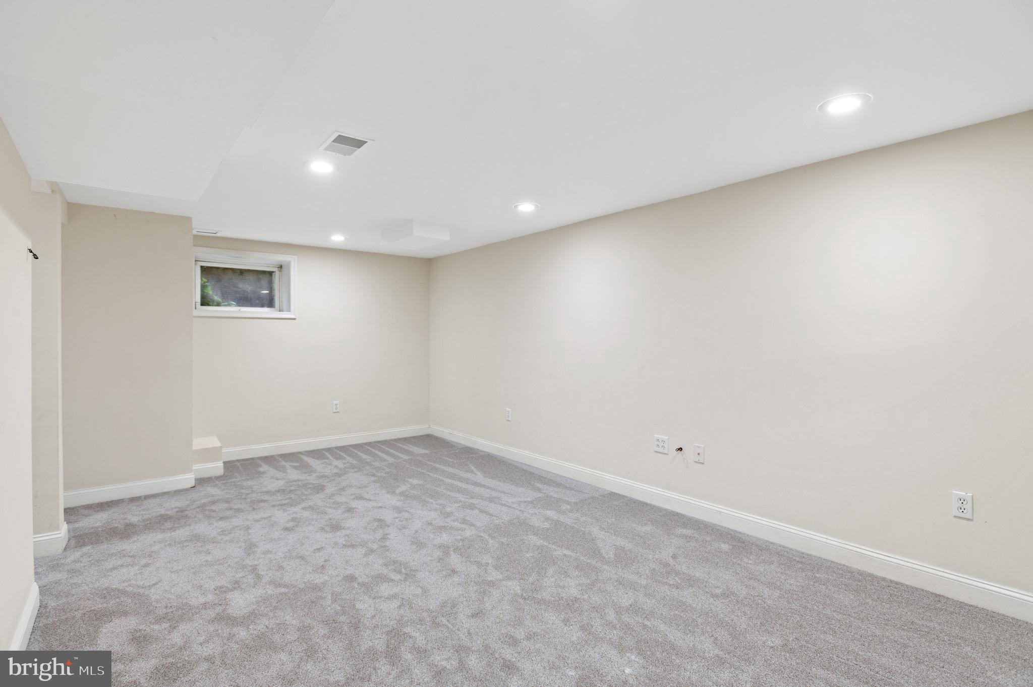 4849 Rodman Street Northwest Washington, DC 20016 - Photo 25 of 30 an empty room with a natural light