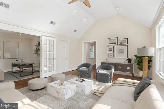 a living room with furniture and a lamp