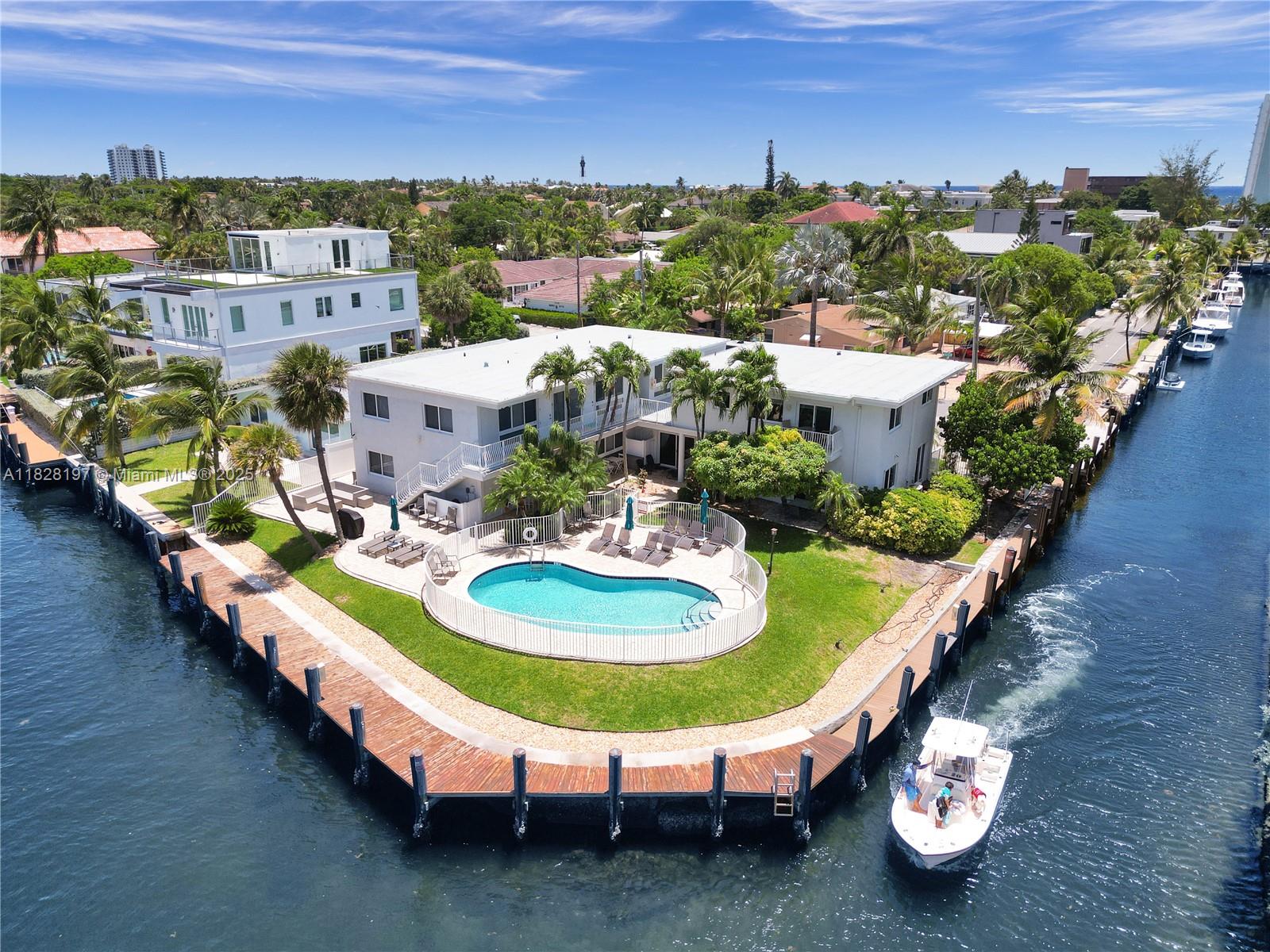 a view of a swimming pool with a yard