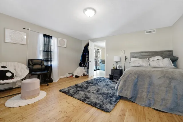 wooden floor with white walls