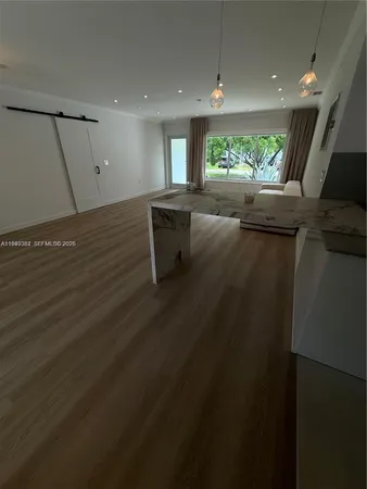 a view of an empty room with a window