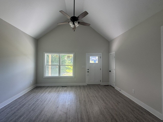 422 Shady Hill Road Dickson, TN 37055 - Photo 5 of 15 an empty room with wooden floor fan and windows