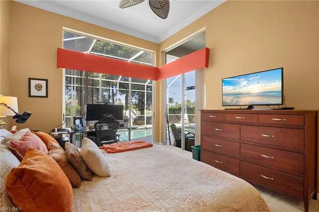 a bedroom with a bed and flat screen tv