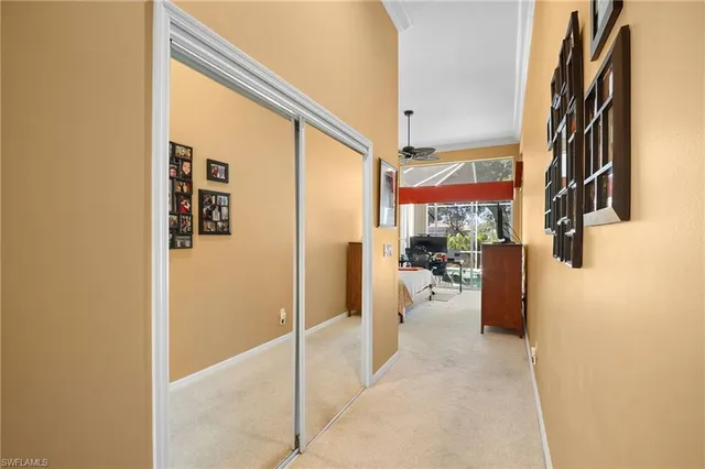 a dining room with furniture and a large window