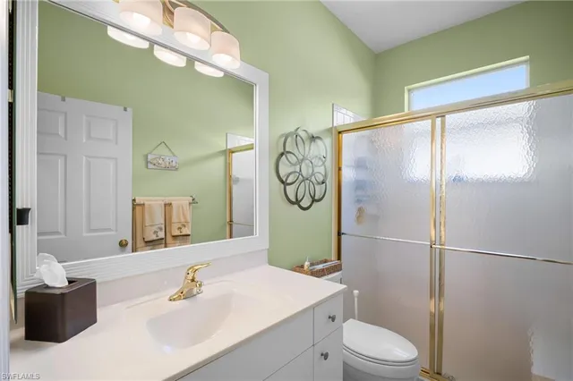 an aerial view of residential houses with outdoor space and street view