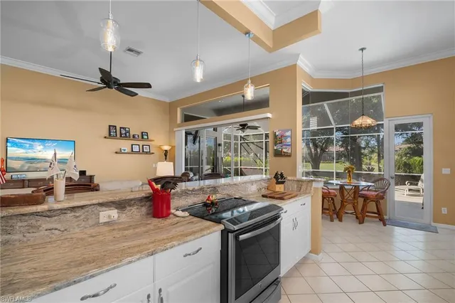 a kitchen that has a lot of cabinets in it