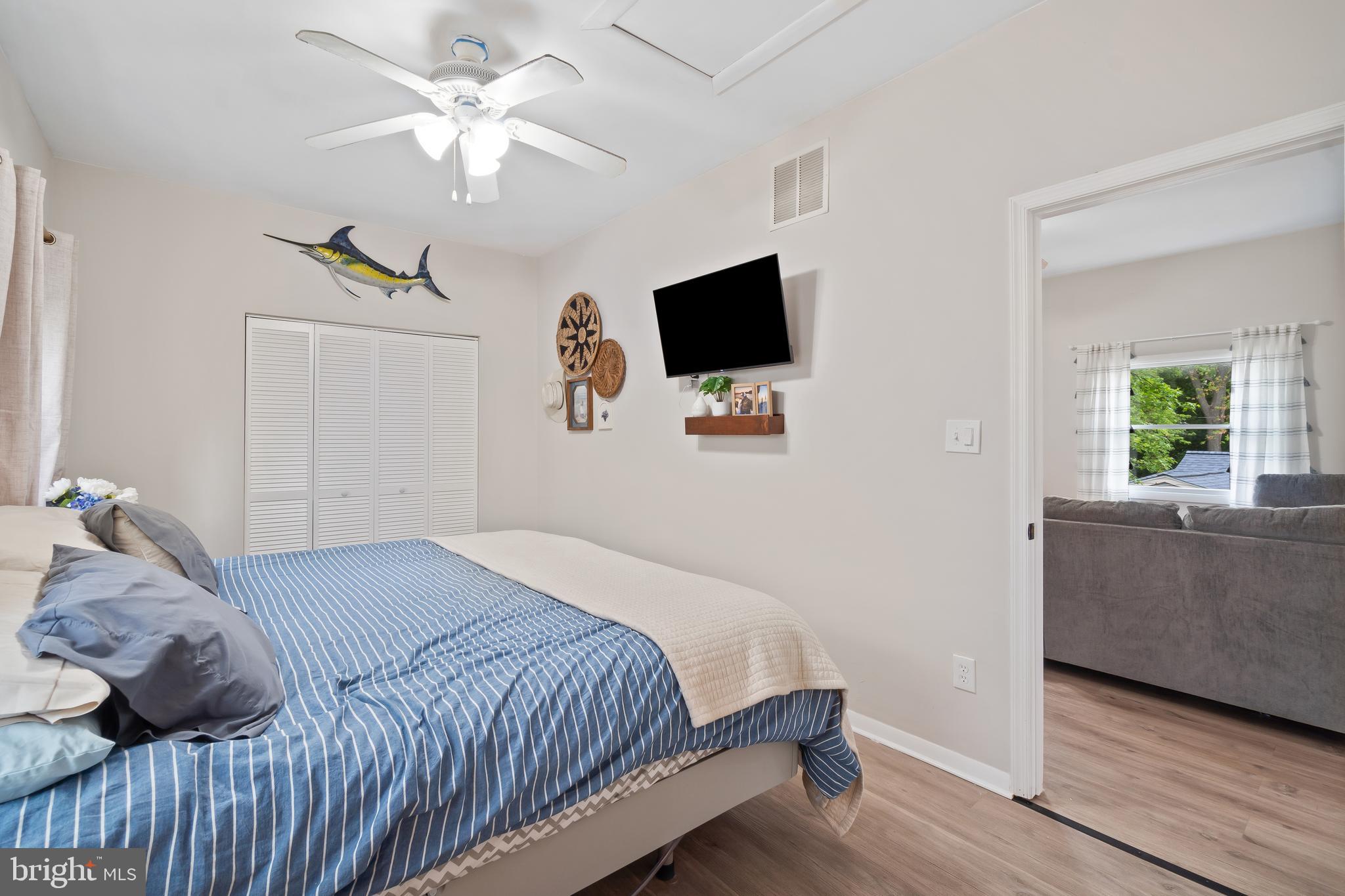 5 Dogwood Road Riva, MD 21140 - Photo 20 of 40 a bedroom with a bed a flat screen tv and a couch