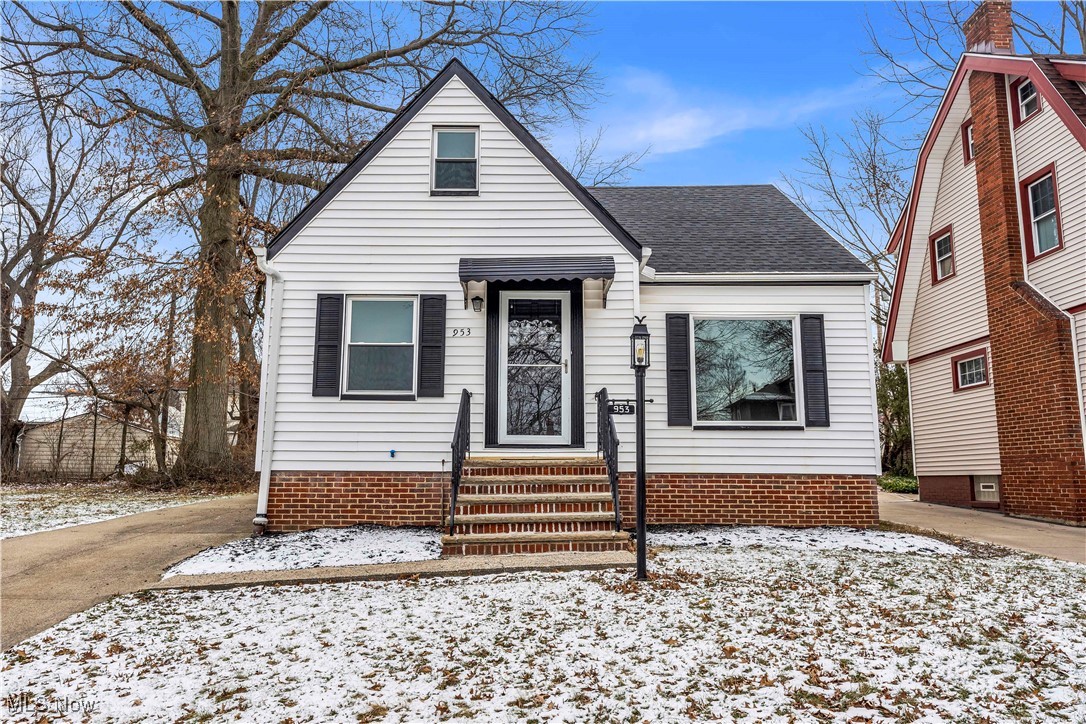 View of front of property with roof with shingles