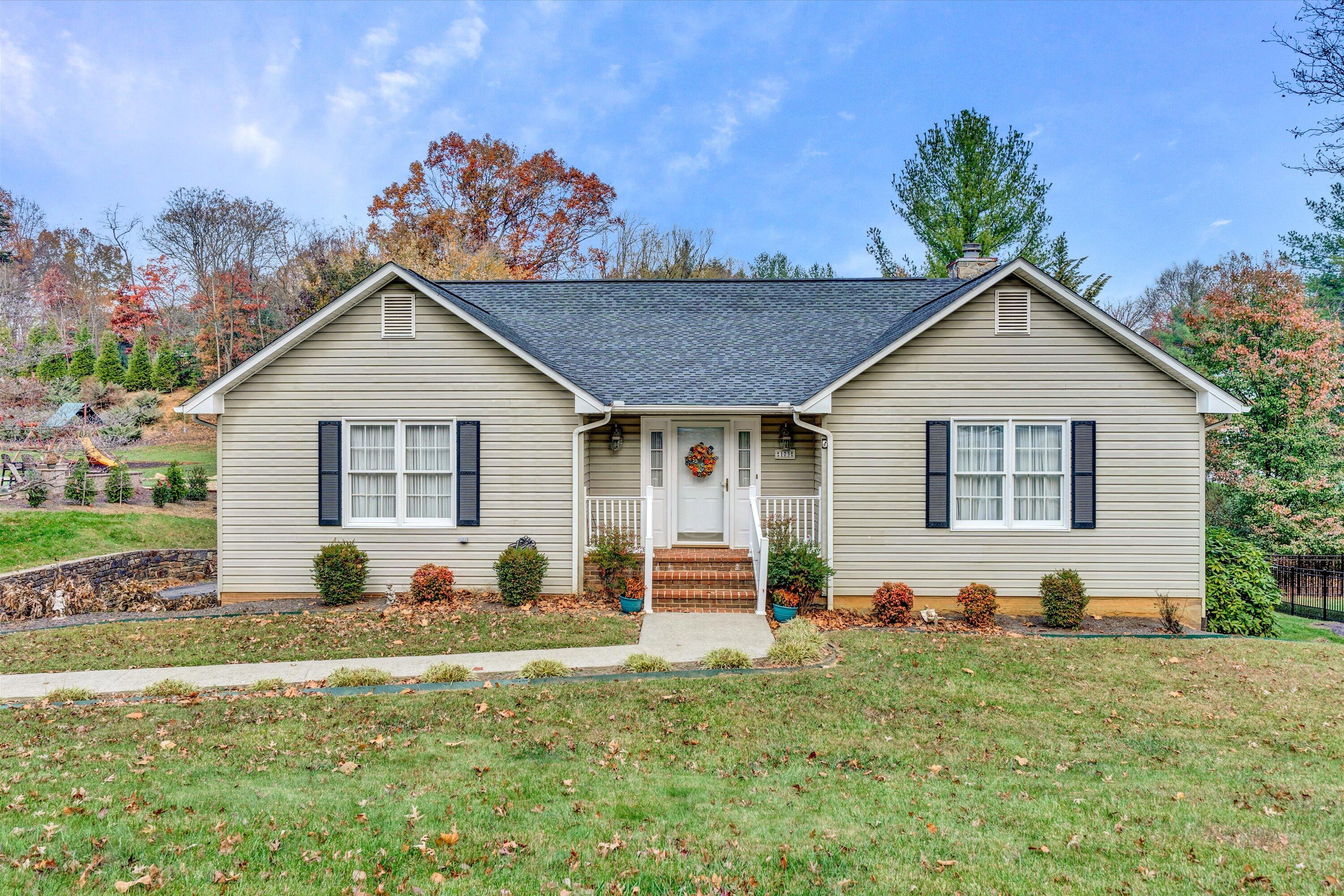 173 Forest Drive Salem, VA 24153 - Photo 1 of 37 a front view of a house with garden