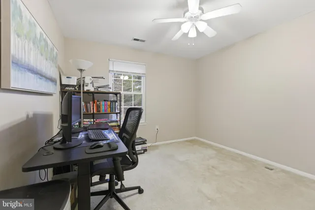 a view of a workspace with furniture